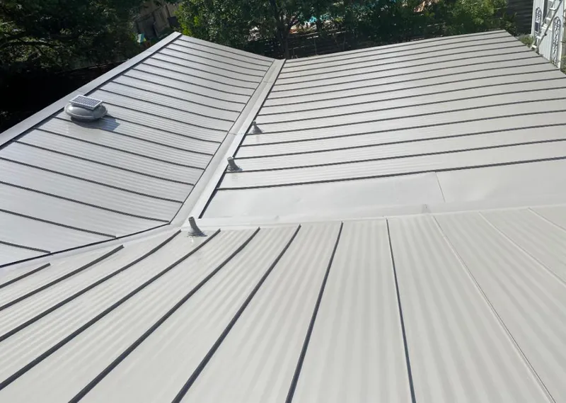 Solar attic fan installed on a metal roof for Roof Ventilation in Rincon